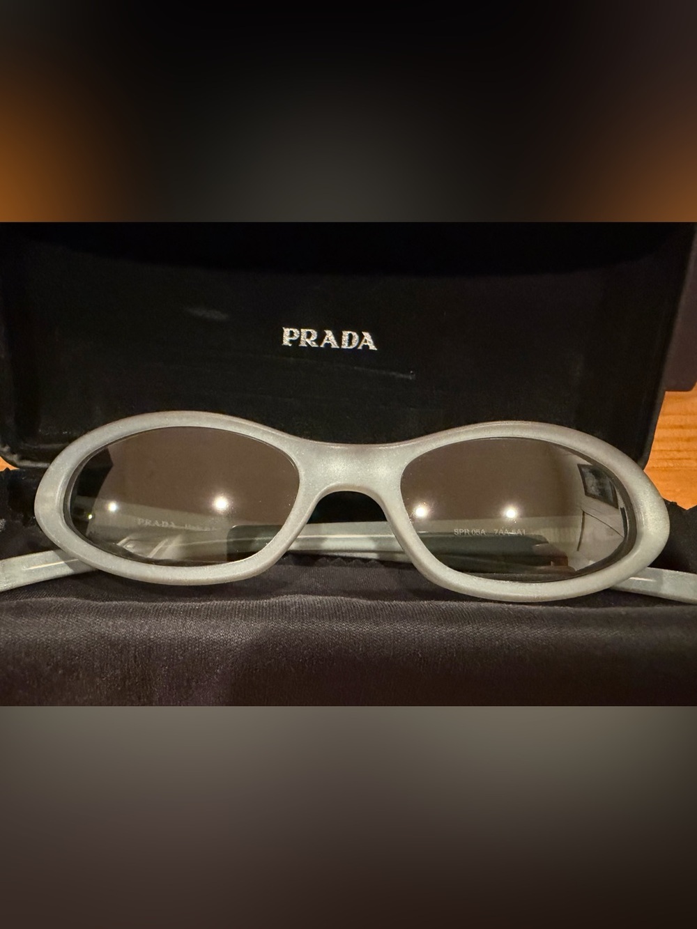 Prada Kids Oval Sunglasses in Light Gray with Dark Lenses